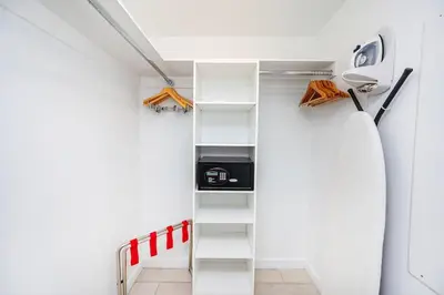 a small room with a ladder in a room at 1 Bed & Kitchen at Beachwalk With Pool Gym Beach in Hallandale Beach