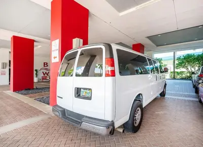 a small white van parked in a garage at 1 Bed & Kitchen at Beachwalk With Pool Gym Beach in Hallandale Beach