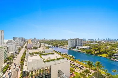 an aerial view of a city with a river and buildings at Fontainebleau Hotel One Bedroom Suite in Miami Beach