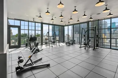 a gym with treadmills and exercise equipment in a building at NEW 28th Floor unit - Breathtaking Bay and Downtown Views in Miami