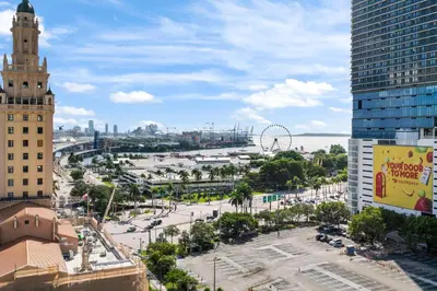 a view of a city with a clock tower at NEW 28th Floor unit - Breathtaking Bay and Downtown Views in Miami