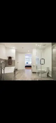 a large bathroom with a tub and a sink at Luxury - Ocean front - Free Parking - 3 Bed 2 Bath in Miami Beach