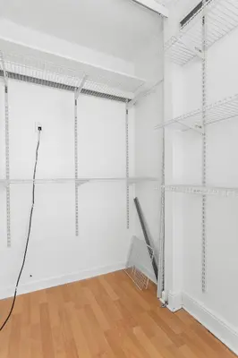 an empty room with white walls and wooden floors at Bay Harbor Sunset Apt 2C in Miami Beach
