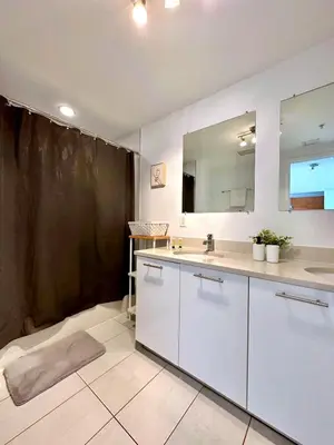 a bathroom with a sink and a mirror at Stylish and Spacious Condo Prefect to Enjoy Miami! in Miami