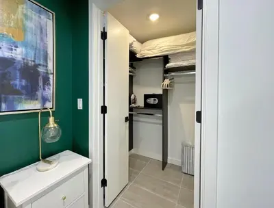 a bedroom with green walls and a bed in a closet at 227-2212AM DOWNTOWN MIAMI STUDIO in Miami