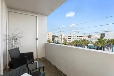 a balcony with a view of a city at Bay Harbor Sunset Apt 4A in Miami Beach