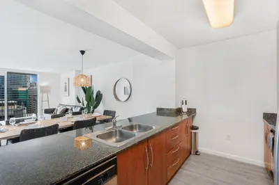 a kitchen with a sink and a counter top at Stylish Brickell Condo with Stunning Views & Premier Amenities in Miami