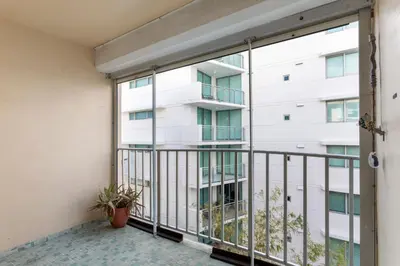 an apartment balcony with a view of a building at Bay Harbor Sunset Apt 4B in Miami Beach