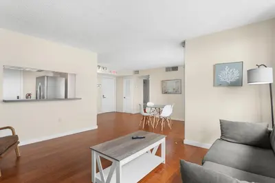 a living room with a couch and a table at Bay Harbor Sunset Apt 5B in Miami Beach
