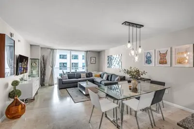 a living room with a couch and a table at Waterfront and City Lights 1-BR With Free Parking in Miami