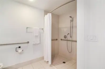 a bathroom with a shower with a shower curtain at Spectacular Apartment with Balcony & Pool in Hallandale Beach