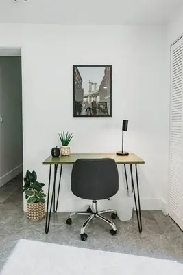 an office with a desk and a chair in a room at Miami Oasis - Unit A in Miami