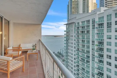 a balcony with a view of the ocean at Cozy 1 Bedroom Apt in The Heart of Brickell in Miami