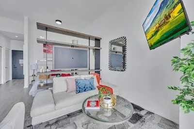 a living room with a white couch and a table at City Views Studio Downtown Miami in Miami