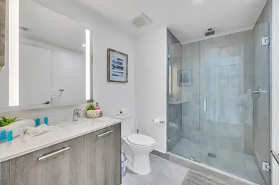 a bathroom with a shower and a toilet and a sink at City Views Studio Downtown Miami in Miami