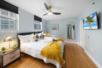 a bedroom with a bed and a ceiling fan at Oceanview Haven Spacious Inviting for 8 Guests in Miami