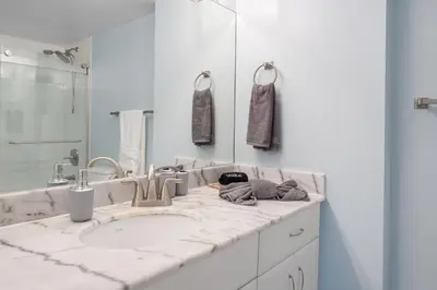 a bathroom counter with a sink and a mirror at Oceanview Haven Spacious Inviting for 8 Guests in Miami