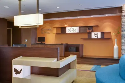 a lobby with a waiting room with a reception desk at Fairfield Inn & Suites by Marriott Fort Lauderdale Pembroke Pines in Pembroke Pines
