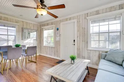 a living room with a ceiling fan and a table at Shared Pool and Backyard Small and Cozy Guest House in Fort Lauderdale