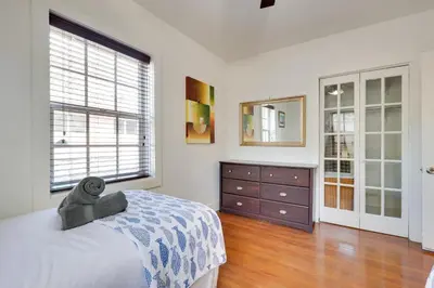 a bedroom with a bed and a dresser and a window at House with Shared Pool Access 4 Mi to Beaches! in Fort Lauderdale
