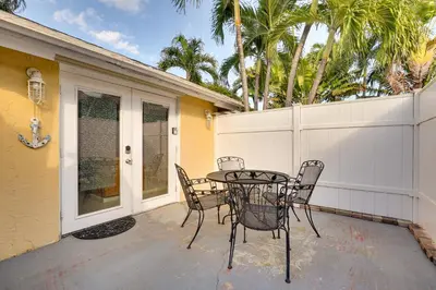 a patio with a table and chairs on a porch at Detached Backyard Studio in Fort Lauderdale! in Fort Lauderdale