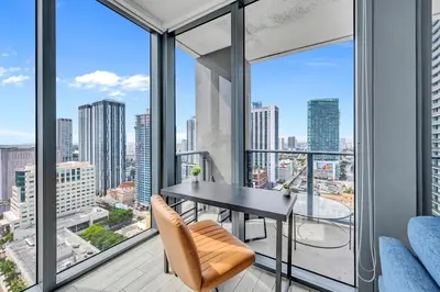 an apartment with a balcony with a table and chairs at Great 3 beds 3 baths Appartment Downtown Miami in Miami