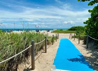 a blue pathway to the beach at Art Deco 1 Bedroom Apartment Steps to Beach in South of Fifth Neighborhood in Miami Beach