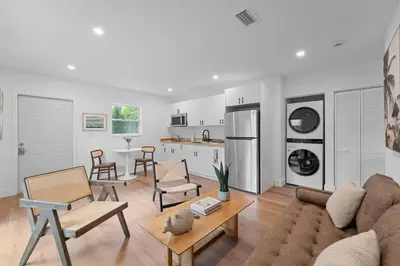 a living room with a couch and a kitchen at 921 Apartment 1 in Fort Lauderdale