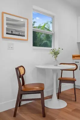 a table and chairs in a kitchen with a window at 921 Apartment 1 in Fort Lauderdale