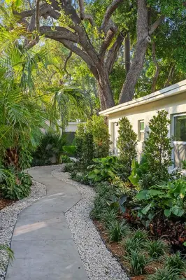 a garden with a walkway next to a house at 921 Apartment 2 in Fort Lauderdale