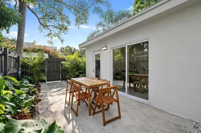 a wooden table and chairs on a patio at 921 Apartment 3 in Fort Lauderdale