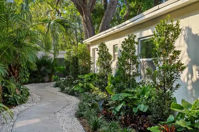a garden path next to a house with plants at 921 Apartment 3 in Fort Lauderdale