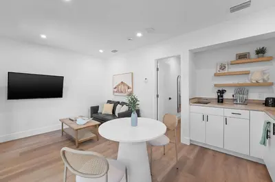 a kitchen and a living room with a table and a counter at 921 Apartment 3 in Fort Lauderdale
