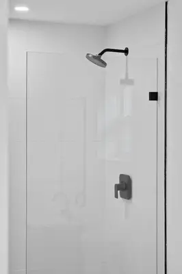 a glass shower door with a shower head at 921 Apartment 4 in Fort Lauderdale