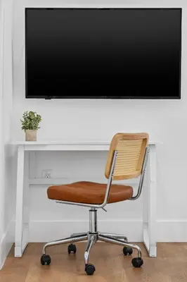 a chair sitting in front of a tv at 921 Apartment 4 in Fort Lauderdale