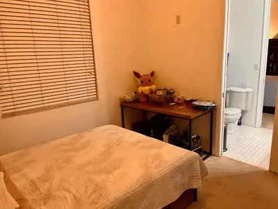 a bedroom with a table with a stuffed animal on it at Two private rooms with private bathroom in shared House in Fort Lauderdale