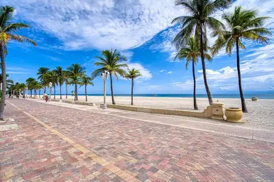a brick street with palm trees on the beach at Casa Roselle 3 Bedrooms in Hollywood