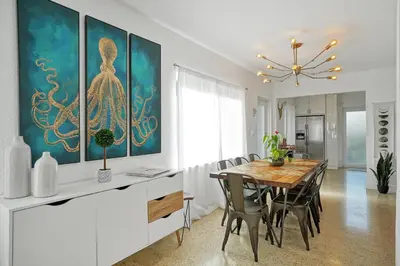 a dining room with a table and some chairs at Buddha House Pool Big Yard in Miami