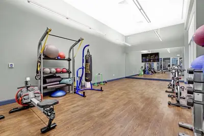 a fitness room with treadmills and exercise equipment at Comfort and Convenience 2BR Unit with Free Parking in Miami