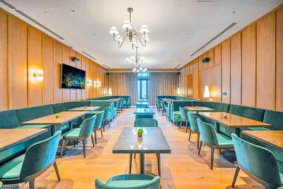 a restaurant with wooden walls and tables and chairs at Stylish One Bedroom in the heart of vibrant Downtown- Daily resort fee and parking not included in Miami