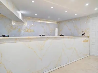 a bar in a room with a marble wall at Luxury 2BD Penthouse with Beach Access and Resort Amenities PH6 in Miami Beach