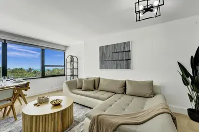 a living room with a couch and a table at Beautiful Oceanview Condo with Beach Service 504 in Miami Beach