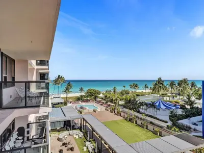 a view of the beach from the balcony of a resort at Beautiful Oceanview Condo 2 Bedrooms, 2 Bathrooms with Beach Service 709 in Miami Beach