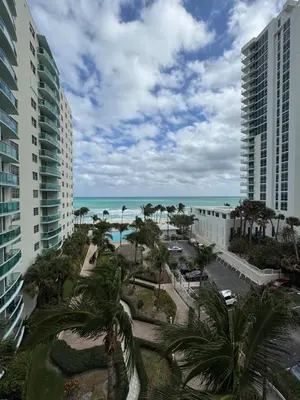 a view of the ocean from the balcony of a resort at 1 bedroom with amazing ocean view in Hollywood