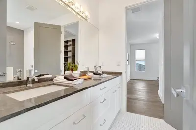 a white bathroom with a sink and a mirror at The Secret Garden - Stunning Luxurious Villa in Fort Lauderdale in Fort Lauderdale