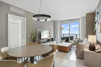 a living room with a table and chairs at Ventur Luxe Condo l Oceanview - Gym, Beach Access in Hollywood