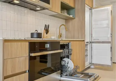 a kitchen with a dish rack on the oven at NEW Luxury Bay View Downtown Studio in Miami
