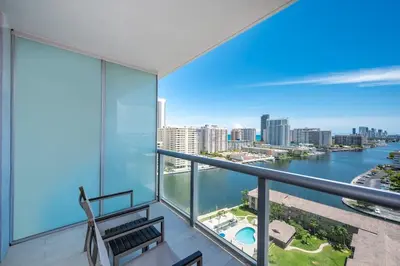 a balcony with a view of the water at Stunning 30th-Floor Studio at Beachwalk Resort in Hallandale Beach