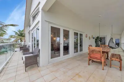 a porch with benches and a table on a house at Charming 2-BR space in Hollywood in Hollywood