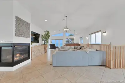 a living room with a couch and a fireplace at One - BR spacious beach place in Hollywood